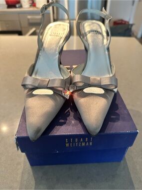 Stuart Weitzman Silver Satin Pointed Toe Slingback Heels with Bow Accent